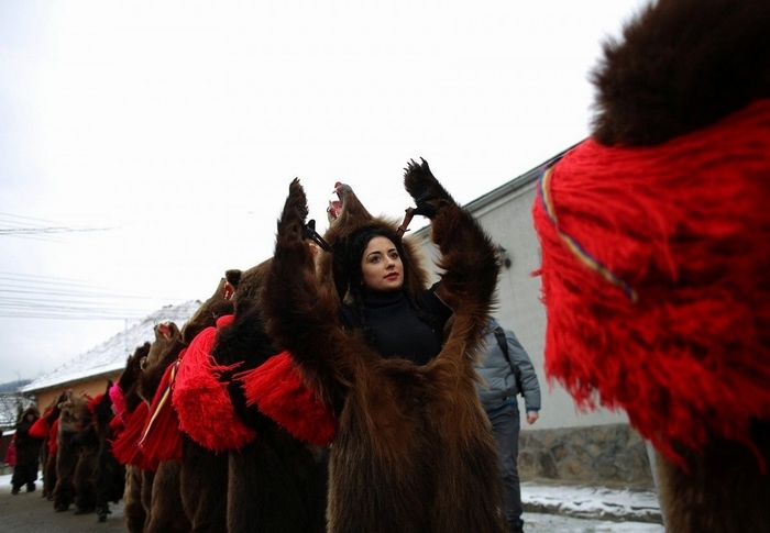 Traditional parade in bearskins of the inhabitants of the Romanian town of Comanesti - Girls, Brown bears, Parade, Romania, Longpost