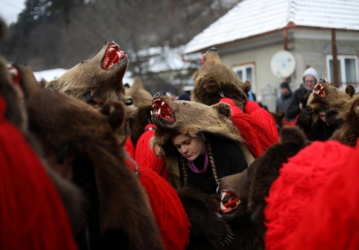 Traditional parade in bearskins of the inhabitants of the Romanian town of Comanesti - Girls, Brown bears, Parade, Romania, Longpost