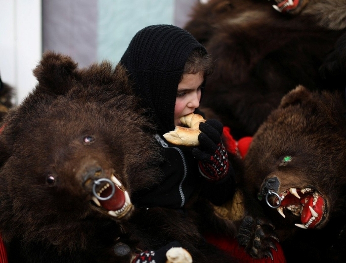 Traditional parade in bearskins of the inhabitants of the Romanian town of Comanesti - Girls, Brown bears, Parade, Romania, Longpost