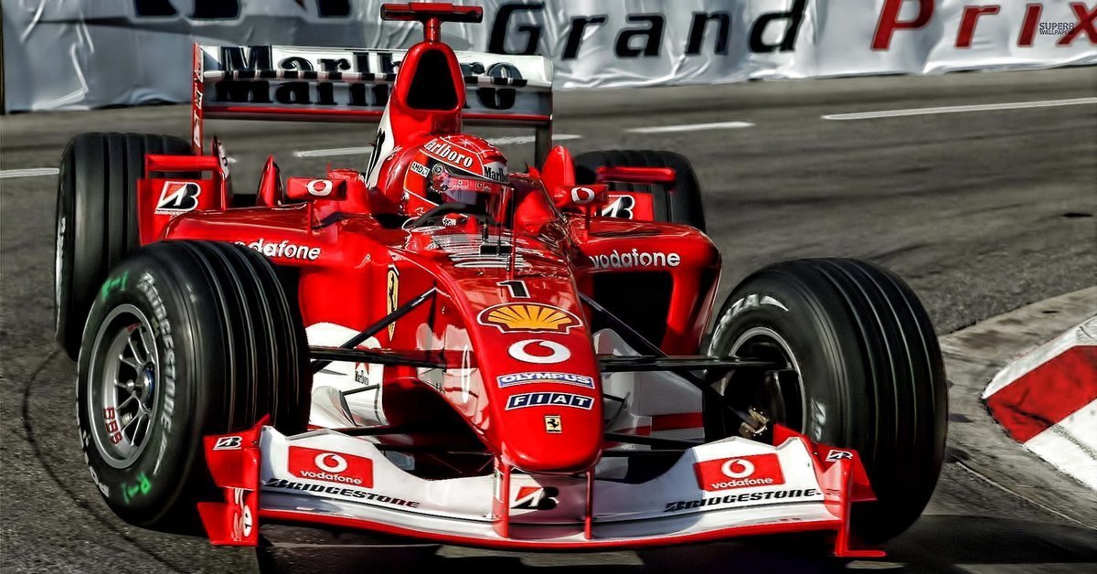 Н 1 спорт. Михаэль Шумахер Ferrari f2004. Формула 1 Михаэль Шумахер. Болид Феррари Михаэля Шумахера. Ferrari f2003-ga.