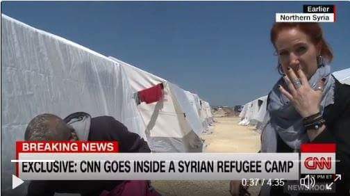 A CNN journalist in a refugee camp sniffs a child's backpack and confirms the fact of a chemical attack by the smell. - Syria, Chemical attack, , Politics