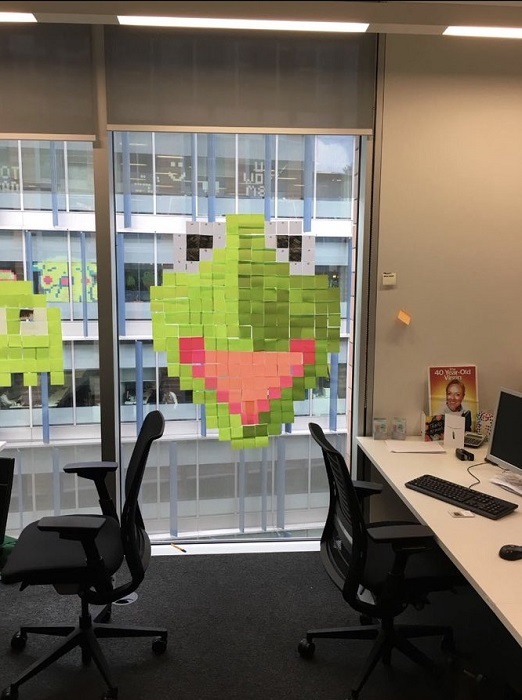 Office workers from neighboring buildings staged a sticker war. Now their windows are covered in paper pixel art - Stickers, Humor, The photo, The fight, Milota, Longpost, Story, Work