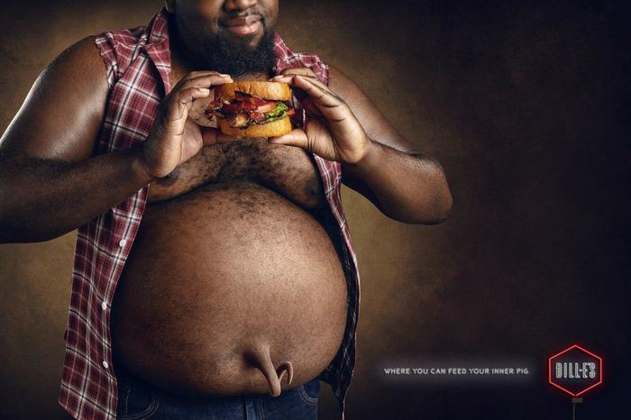 Странная реклама бургерного ресторана: "Там, где вы можете накормить вашу внутреннюю свинью