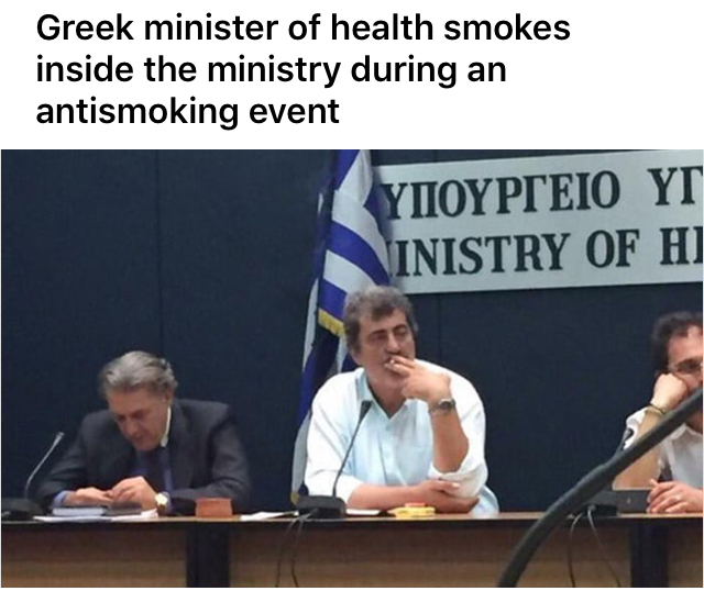 The Minister of Health of Greece smokes in the ministry, during an anti-tobacco conference. - The minister, Smoking