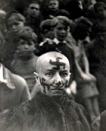 The woman's head is shaved as a punishment for collaborating with the Germans after the liberation of France in 1944. - The photo, France, 1944, Fascism, Treason, Punishment