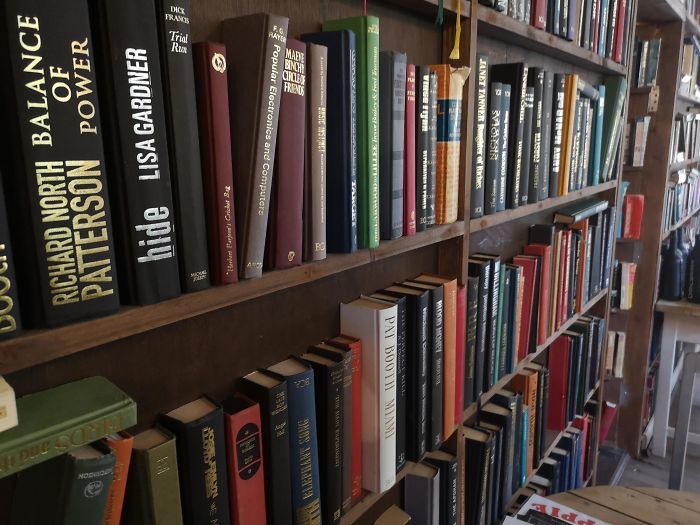 I wouldn't be surprised if the owner or designer of this place is found dead one day with someone's bookplate on his forehead. - Books, Bookshelf, Vandalism, Interior, Cafe