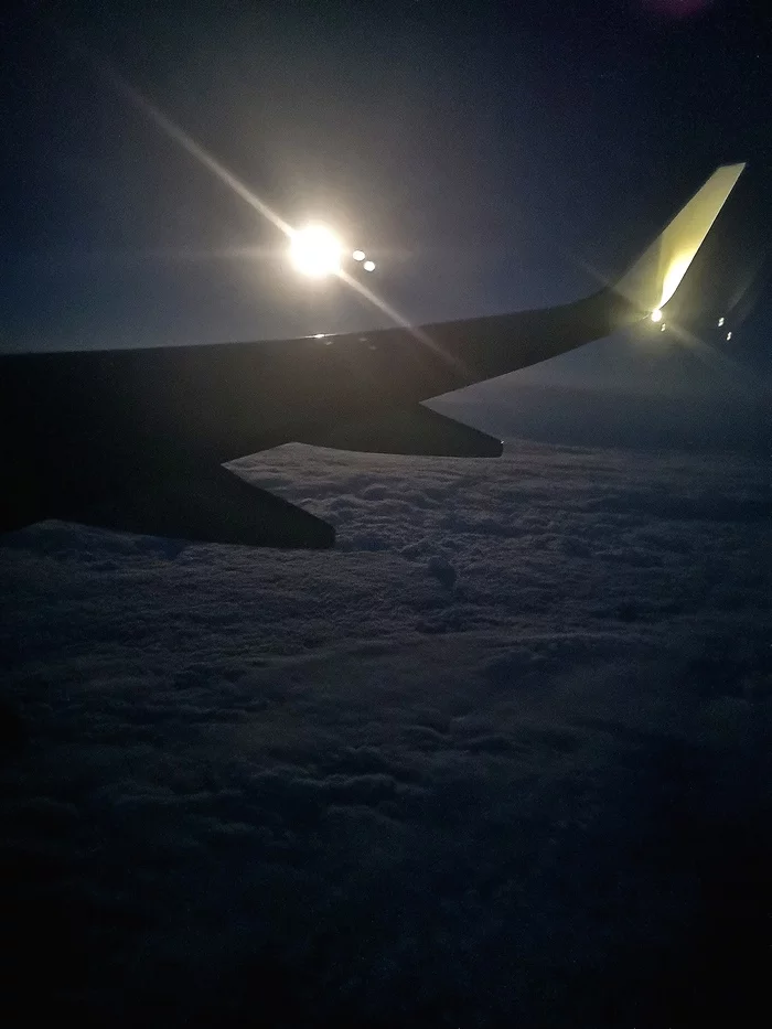 The moon is visible through the porthole... - My, Flight, moon