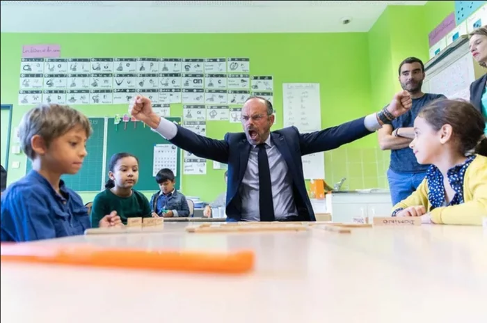 Former French Prime Minister Edouard Philippe wins children's dominoes during a school visit, July 2020 - France, Dominoes, Children, Emotions, Images
