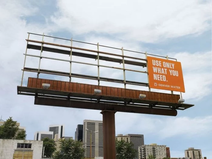 Denver Water's clever billboard: Use only what you need. A corner of a billboard was enough for this advertisement. - Advertising, Billboard, What you need