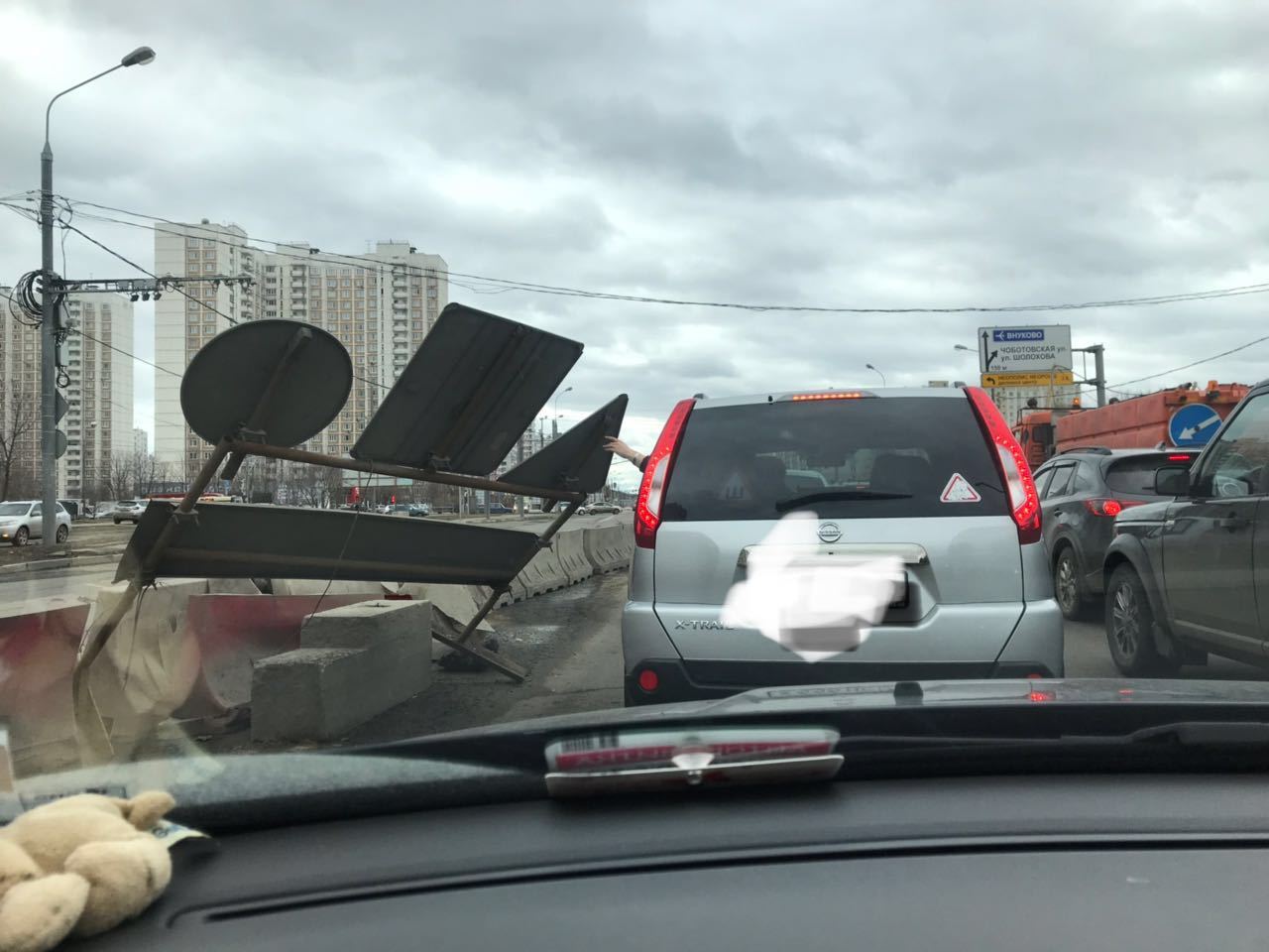 And it's windy today. The girl holds a sign so that he does not fall on the car - My, Wind, Signs, The photo