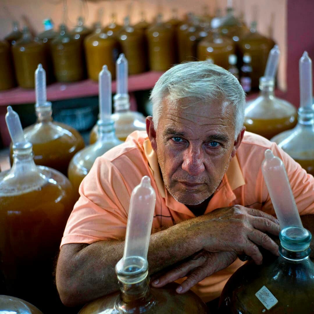 Nothing unusual, just a Cuban watching the fermentation of the national alcoholic drink. - Cuba, The photo, Photographer, Interesting, Humor, Condoms, Funny