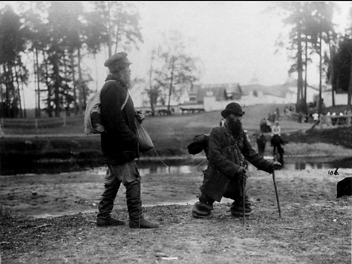 Two wanderers walk along the river to the Sarov Monastery: a legless man leads a blind man by a rope, 1903. - Path, Monastery