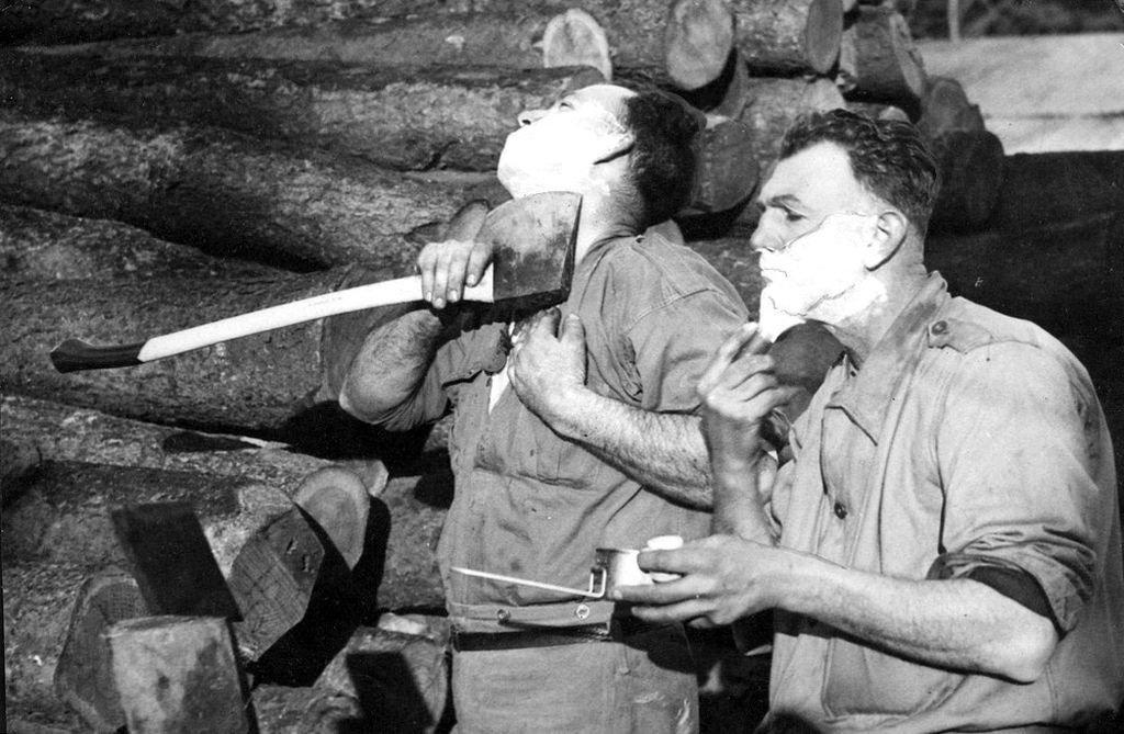 Australian lumberjacks shaving with axes during World War II, 1941. - Axe, Shaving, Australia, The Second World War