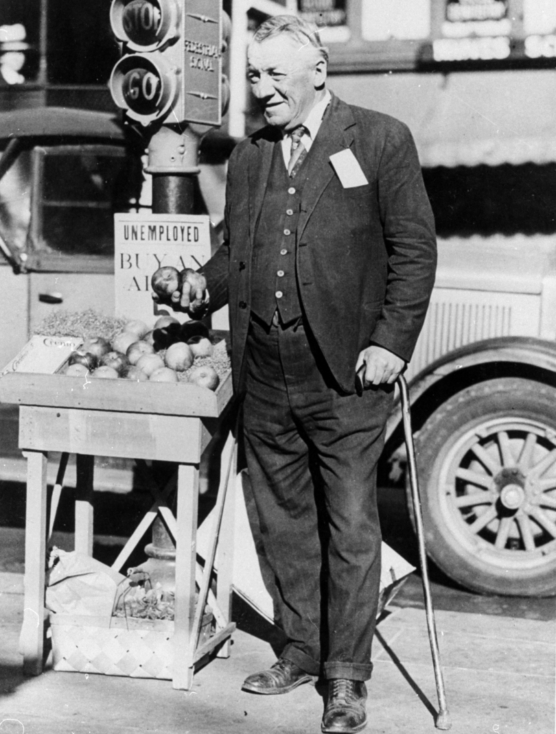 A former millionaire sells apples from a stand. 1931, San Francisco - The Great Depression, USA